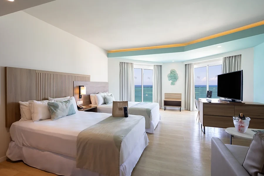 Two queen beds with ocean views at Hotel Riu Palace Antillas