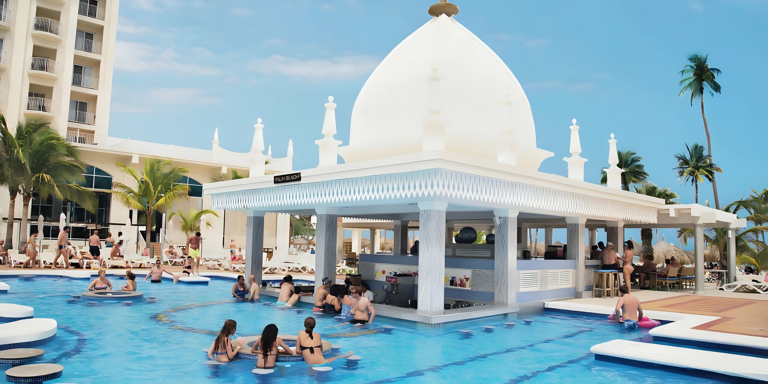 Riu Palace Aruba swim-up pool bar with guests